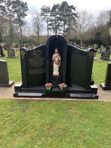 Gravestone With Jesus Figure